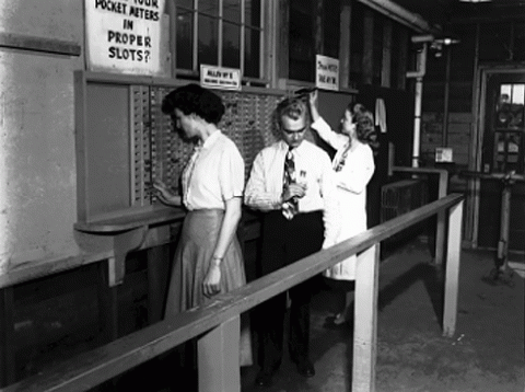 Oak Ridge National Laboratory workers turning in their pocket dosimeters (circa 1950)